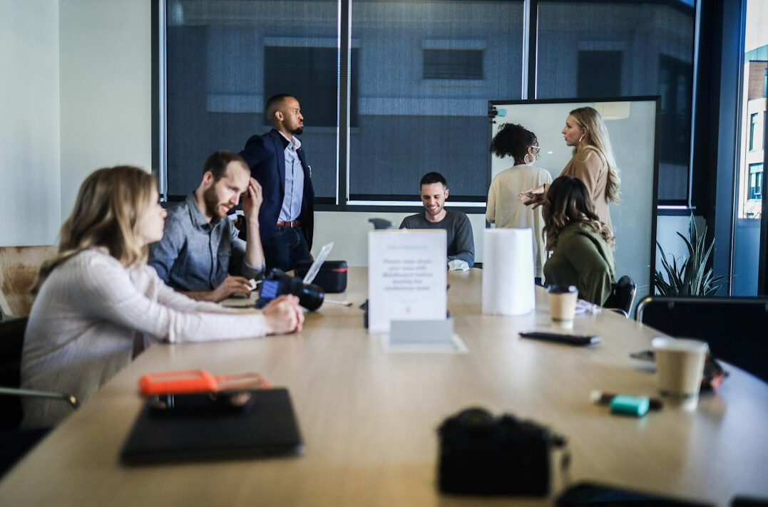 team using technology in meeting